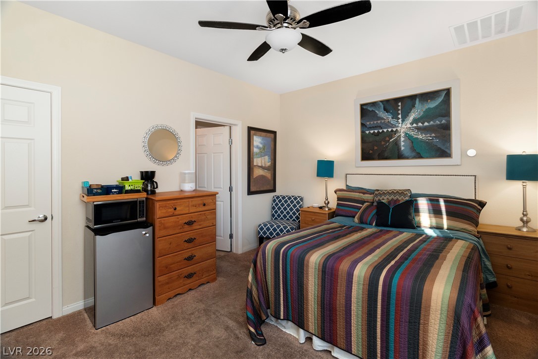 2079 Port Royal Drive Laughlin, NV 89029 - Photo 45 of 86 Carpeted bedroom in Casita / private guest quarters featuring stainless steel refrigerator and a ceiling fan