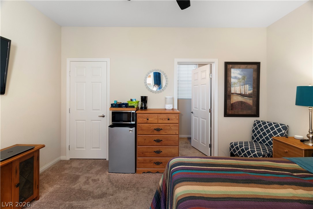 2079 Port Royal Drive Laughlin, NV 89029 - Photo 46 of 86 Bedroom in Casita / private guest quarters with stainless steel refrigerator, light carpet, and a ceiling fan