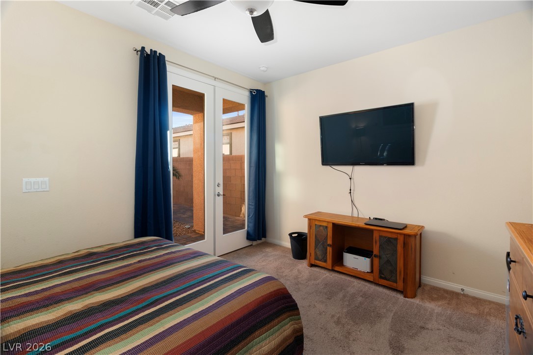 2079 Port Royal Drive Laughlin, NV 89029 - Photo 47 of 86 Bedroom in Casita / private guest quarters featuring access to outside, french doors, ceiling fan, and light carpet