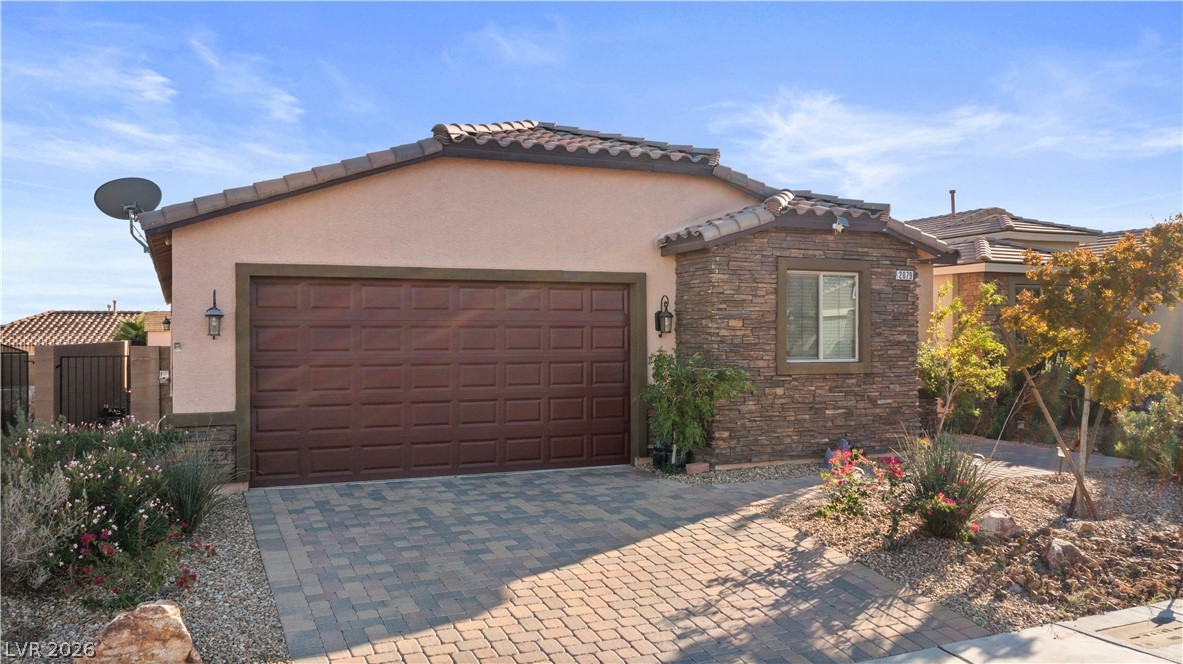 2079 Port Royal Drive Laughlin, NV 89029 - Photo 83 of 86 Mediterranean / spanish house with stone siding, stucco siding, decorative driveway, and a garage