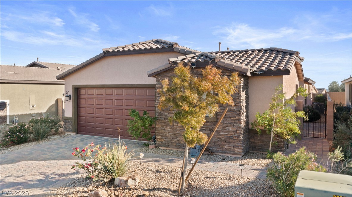 2079 Port Royal Drive Laughlin, NV 89029 - Photo 84 of 86 Mediterranean / spanish house with stucco siding, a tile roof, decorative driveway, and a garage