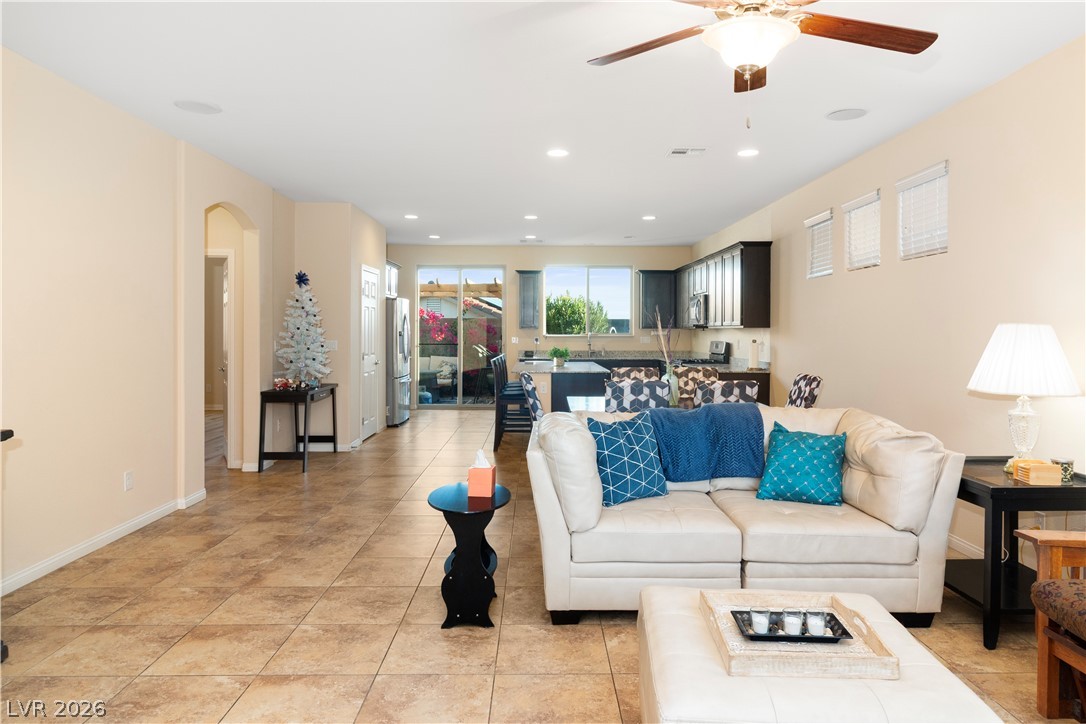 2079 Port Royal Drive Laughlin, NV 89029 - Photo 9 of 86 Living room with arched walkways, recessed lighting, light tile patterned flooring, and a ceiling fan