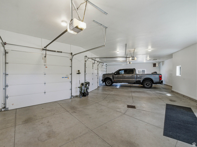 402 Shadow Hill Road Wanship, UT 84017 - Photo 63 of 90 Garage featuring a garage door opener