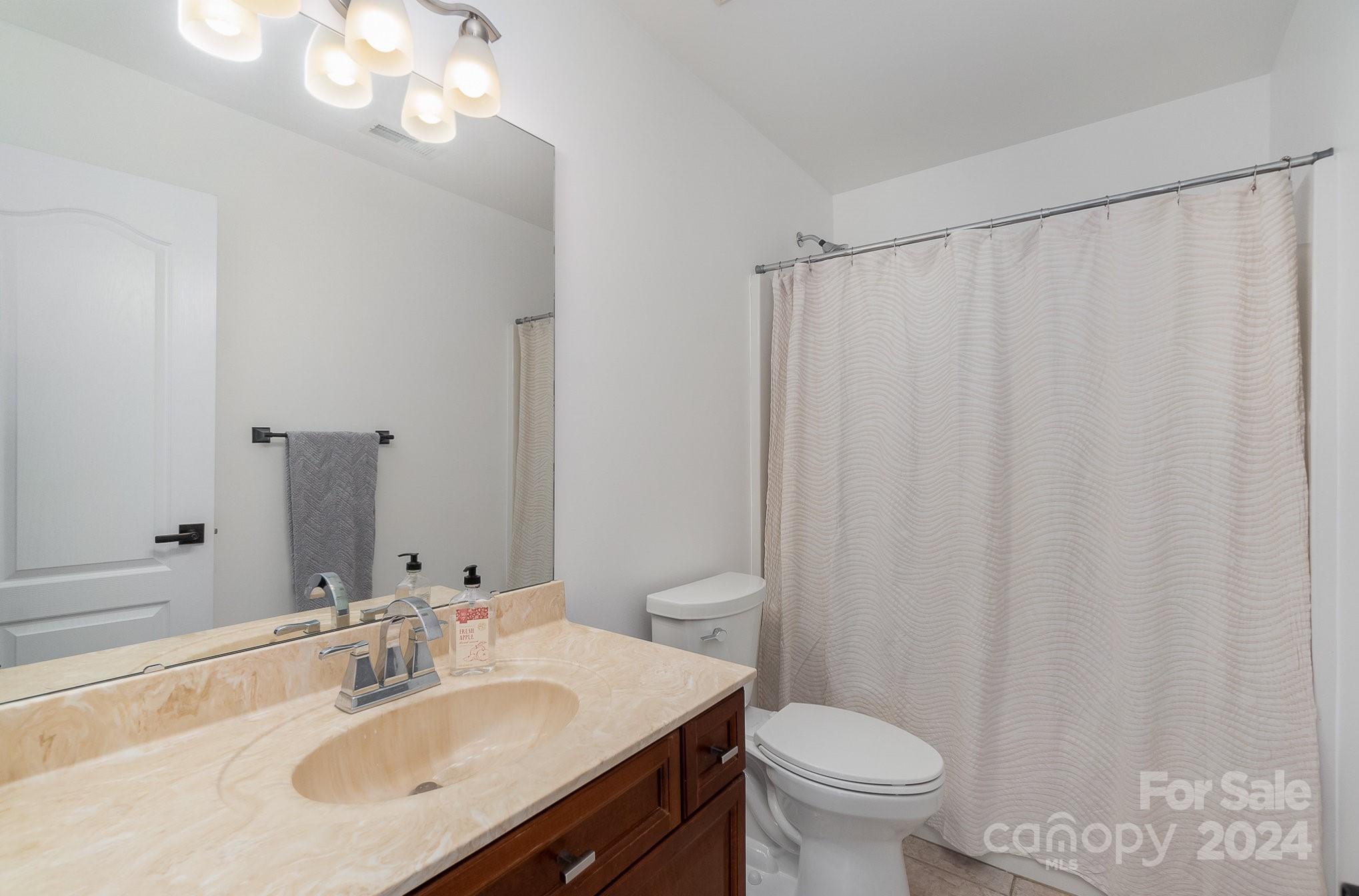2070 Applebrook Drive Monroe, NC 28110 - Photo 15 of 35 a bathroom with a sink toilet and a mirror