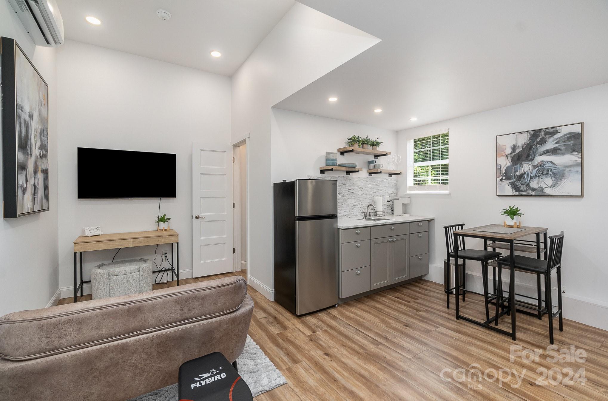 2070 Applebrook Drive Monroe, NC 28110 - Photo 21 of 35 a living room with furniture and a flat screen tv
