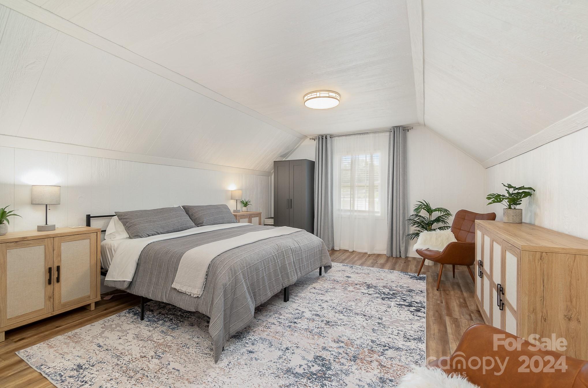 2070 Applebrook Drive Monroe, NC 28110 - Photo 22 of 35 a bedroom with a bed and wooden floor