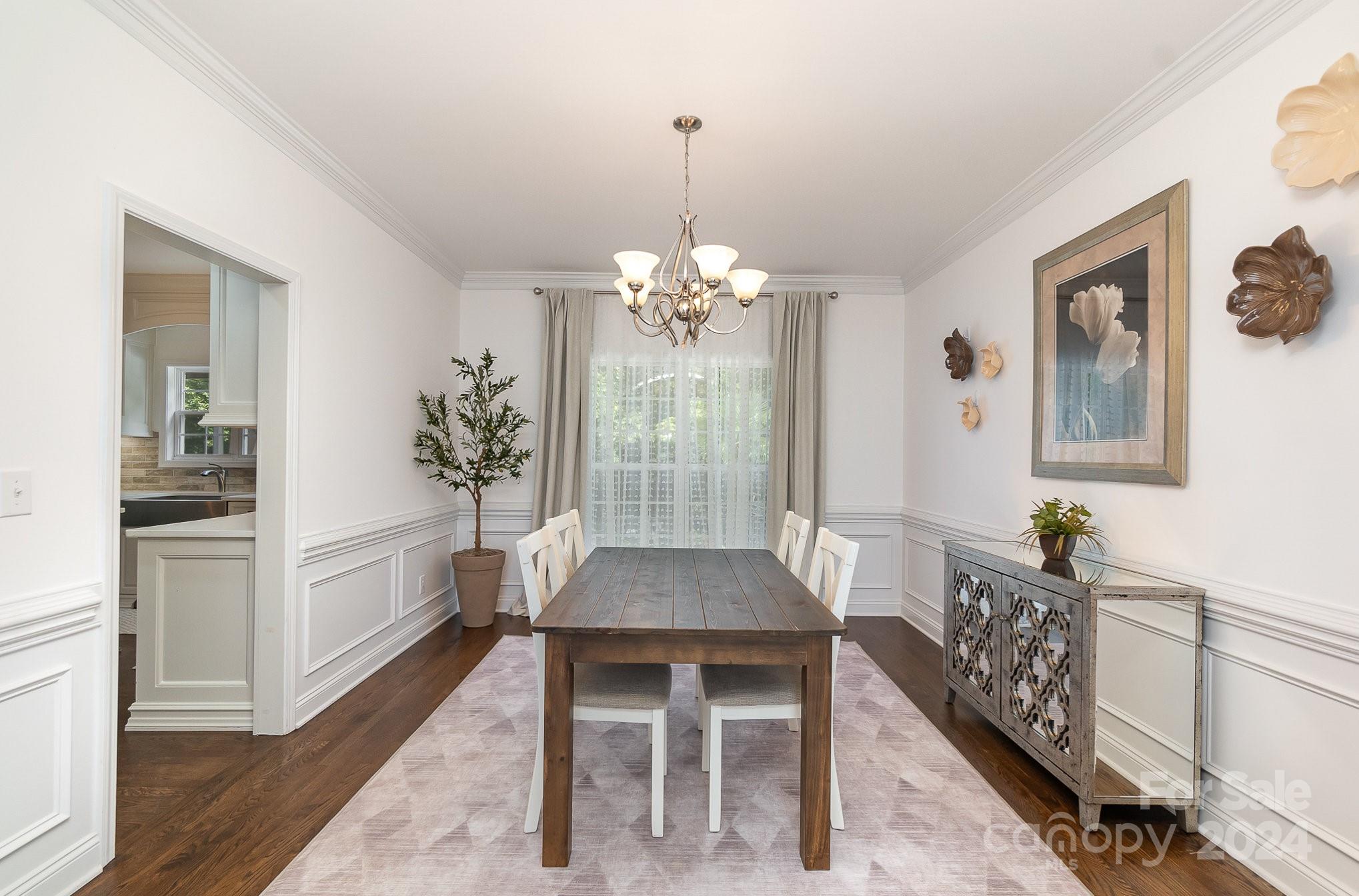 2070 Applebrook Drive Monroe, NC 28110 - Photo 3 of 35 a living room with furniture and a chandelier