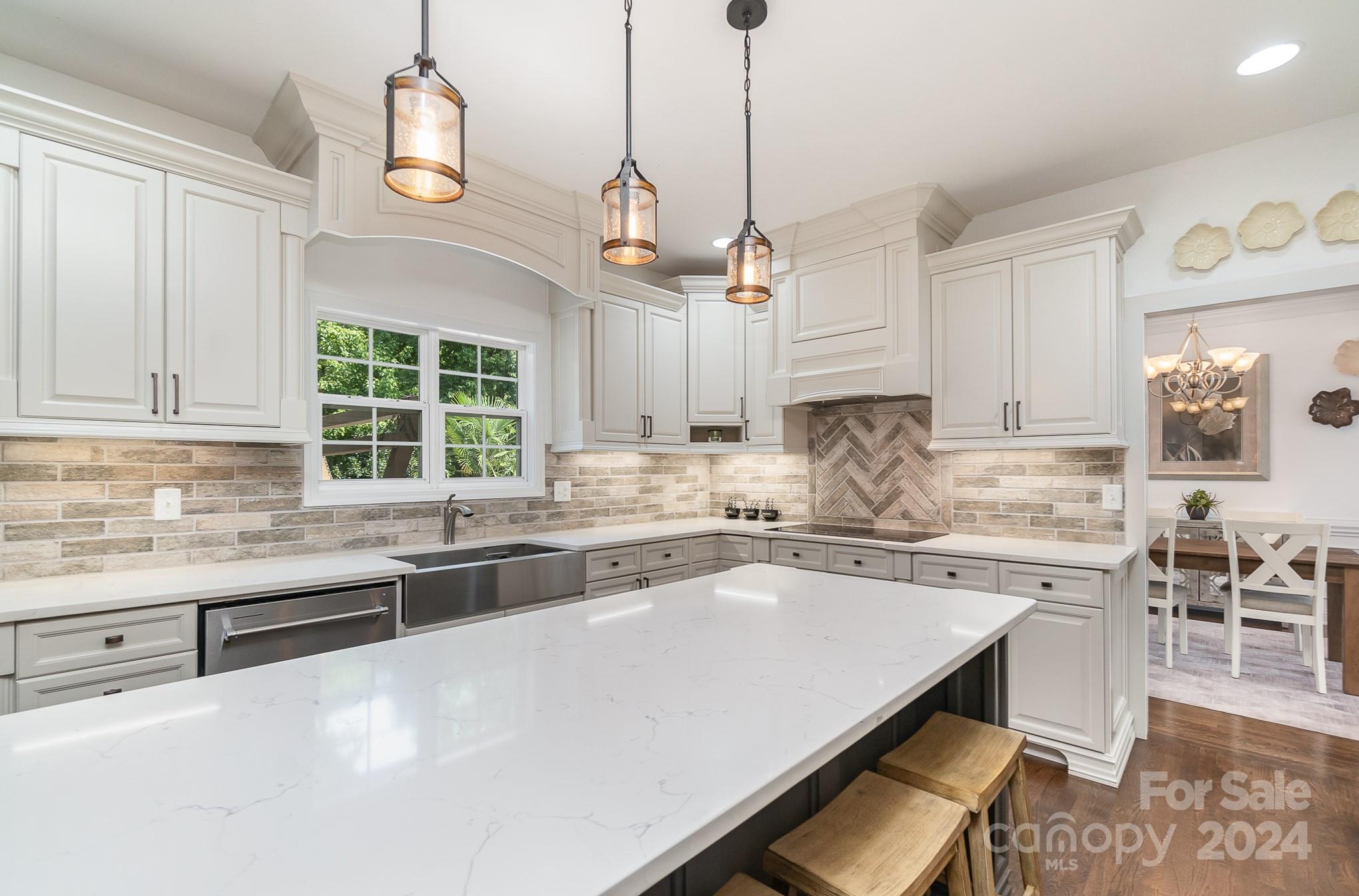 2070 Applebrook Drive Monroe, NC 28110 - Photo 9 of 35 a kitchen with stainless steel appliances granite countertop a sink a stove and a center island