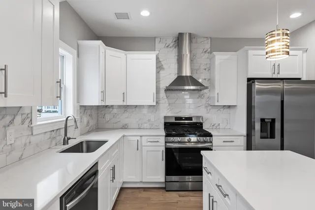 a bathroom with a sink a toilet and bathtub