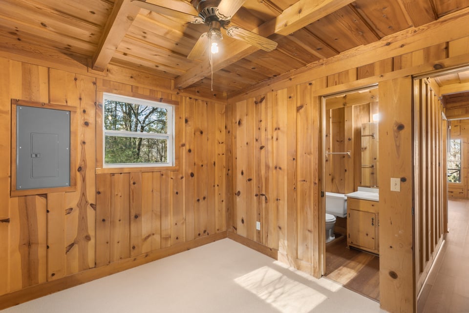 795 Buck Falls Road Highlands, NC 28741 - Photo 25 of 39 Bedroom with en-suite full bath, new windows, and wood interior
