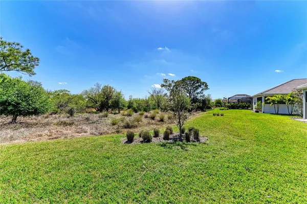 an aerial view of a house with a ocean view