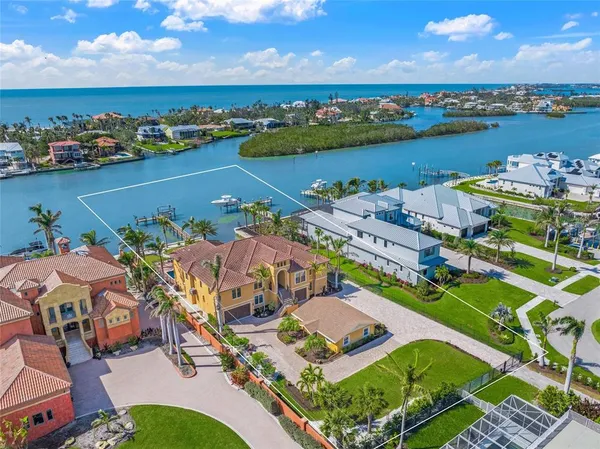an aerial view of a house with outdoor space