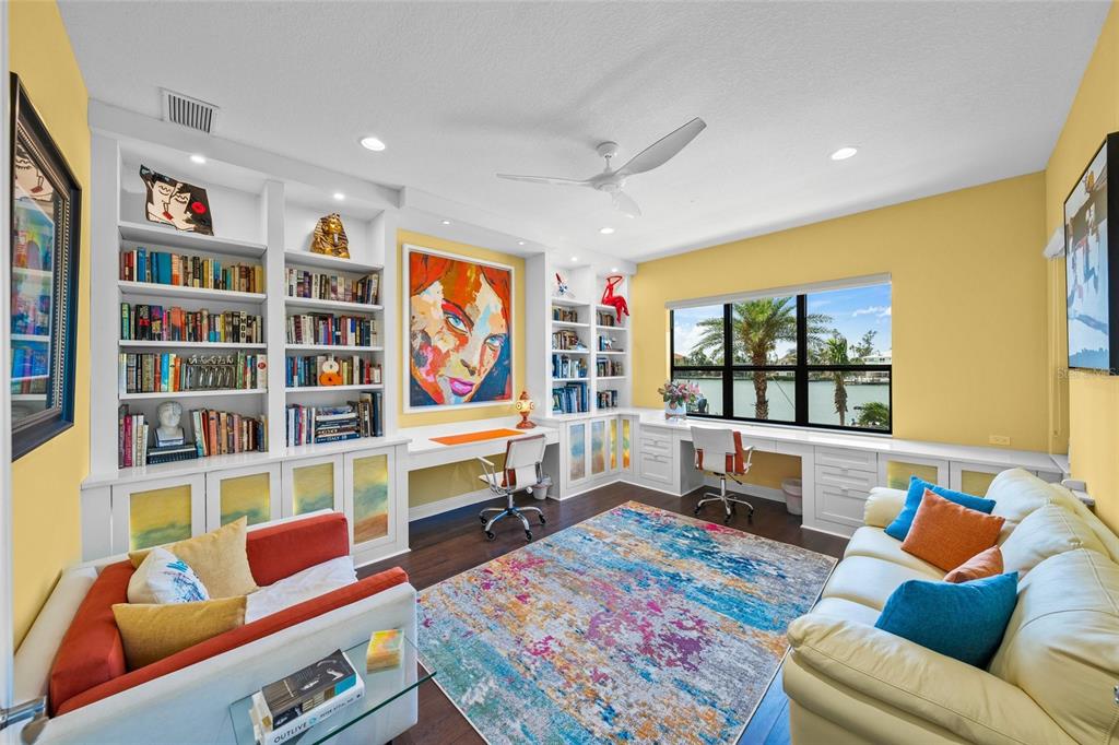 471 Bayshore Road Nokomis, FL 34275 - Photo 16 of 95 a living room with furniture and a book shelf