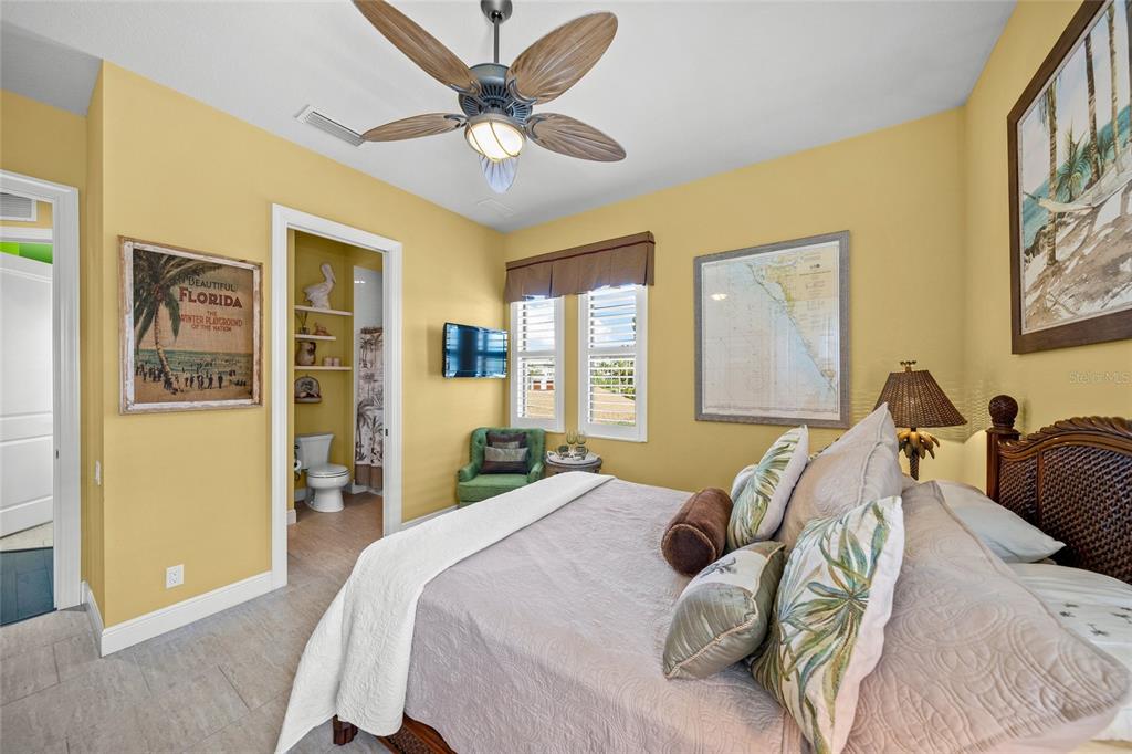 471 Bayshore Road Nokomis, FL 34275 - Photo 23 of 95 a bedroom with a bed and wooden floor