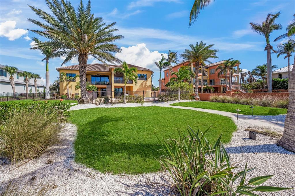 471 Bayshore Road Nokomis, FL 34275 - Photo 36 of 95 a view of a palm trees in front of a house