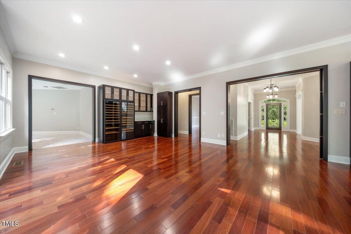 6300 Swallow Cove Lane Raleigh, NC 27614 - Photo 10 of 67 a view of empty room with wooden floor and floor to ceiling window