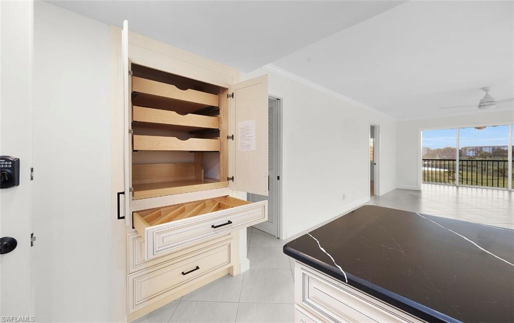 29 High Point Circle East, Unit 308 Naples, FL 34103 - Photo 13 of 39 a room with storage and utility