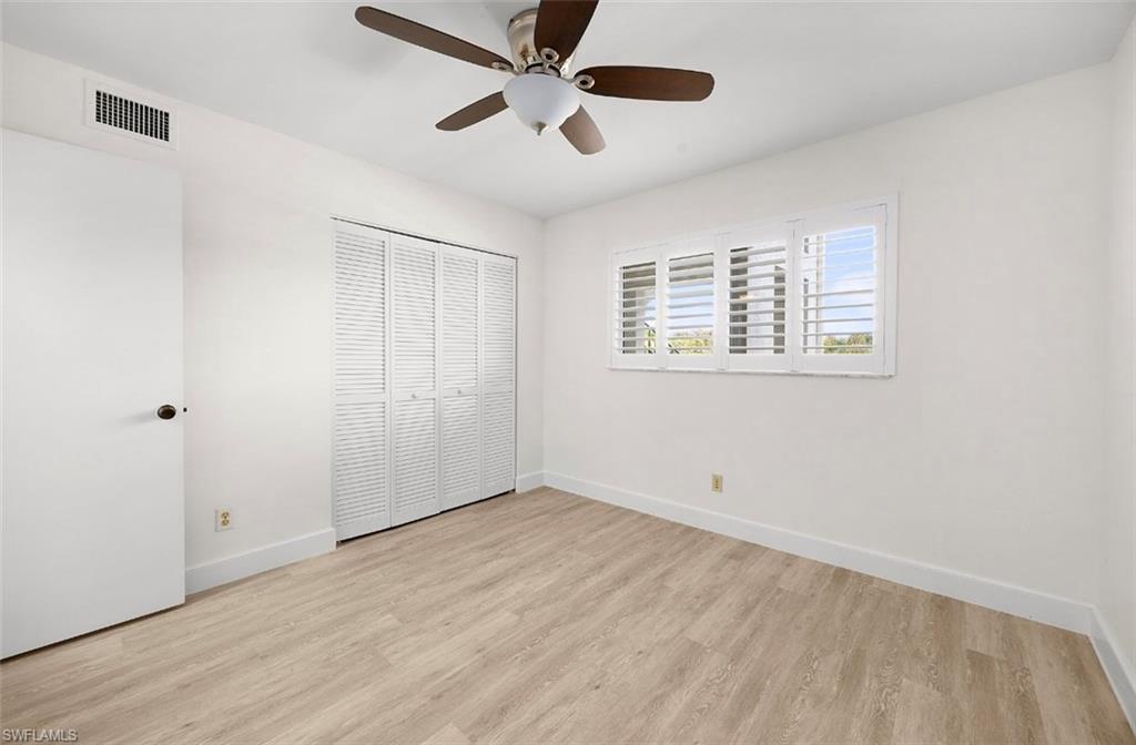 29 High Point Circle East, Unit 308 Naples, FL 34103 - Photo 15 of 39 a view of an empty room with a window