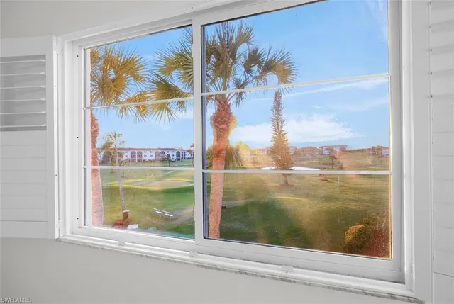 a view of a glass door with a view of the window