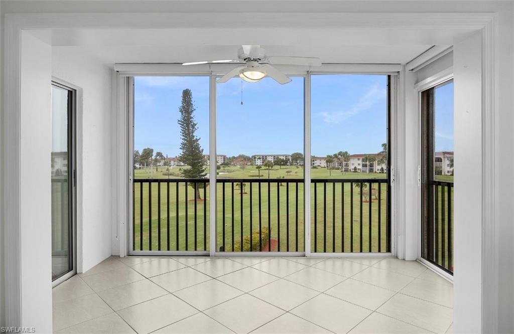 29 High Point Circle East, Unit 308 Naples, FL 34103 - Photo 2 of 39 a view of a balcony with furniture
