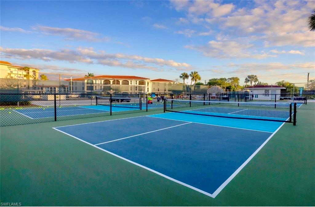 29 High Point Circle East, Unit 308 Naples, FL 34103 - Photo 30 of 39 a view of an outdoor space and basketball court