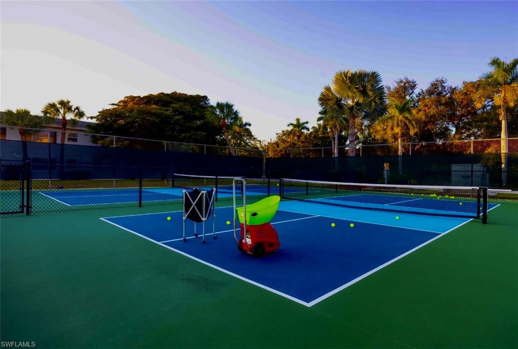 29 High Point Circle East, Unit 308 Naples, FL 34103 - Photo 31 of 39 a view of a tennis court