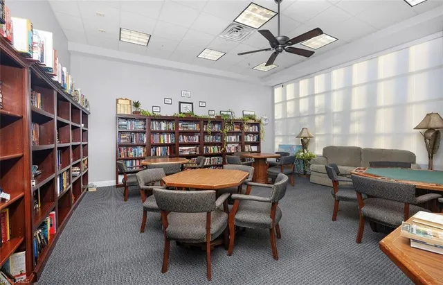 a view of a livingroom with furniture and a bookshelf
