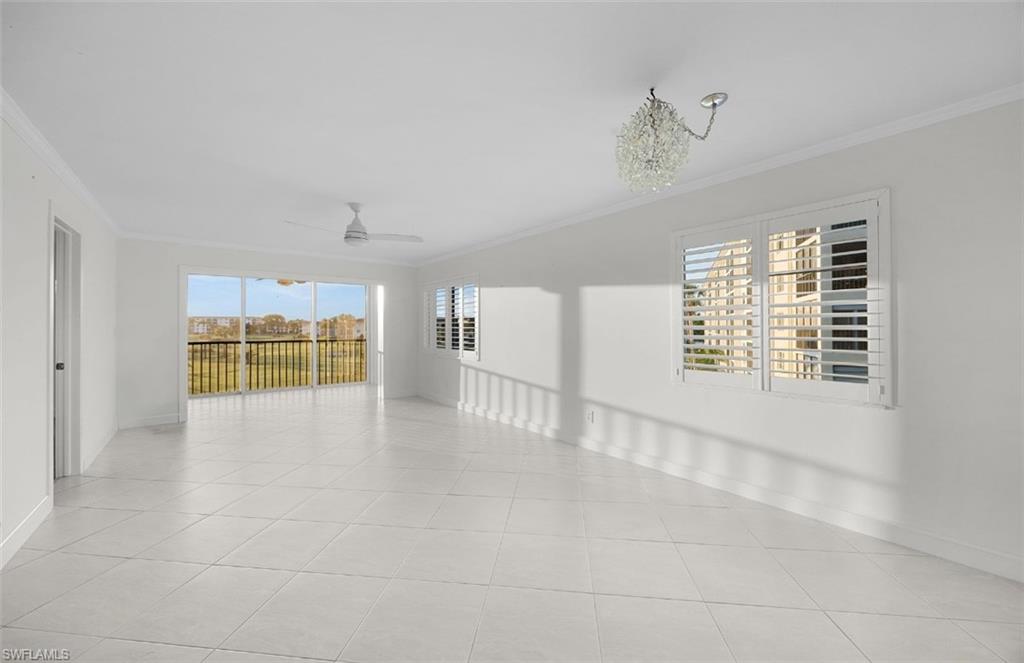 29 High Point Circle East, Unit 308 Naples, FL 34103 - Photo 5 of 39 a view of an empty room with a window