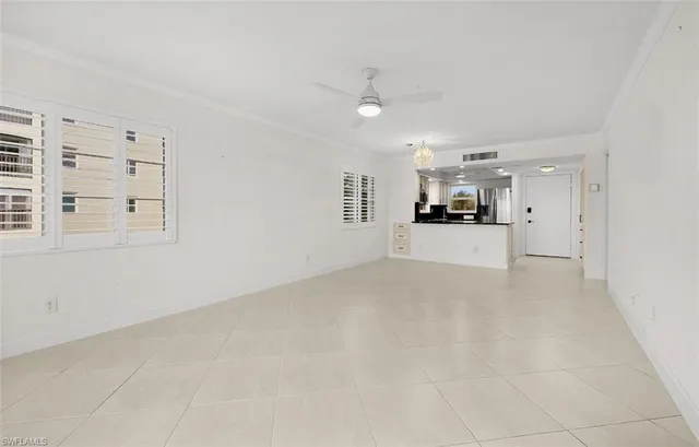 a view of a kitchen with a sink and a window
