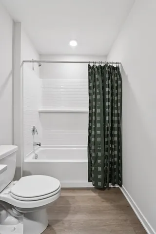 a bathroom with a toilet a sink and a bathtub