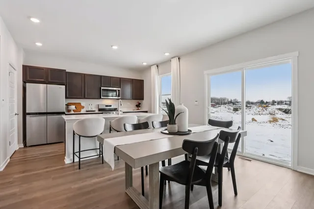 a view of kitchen with a table and chairs