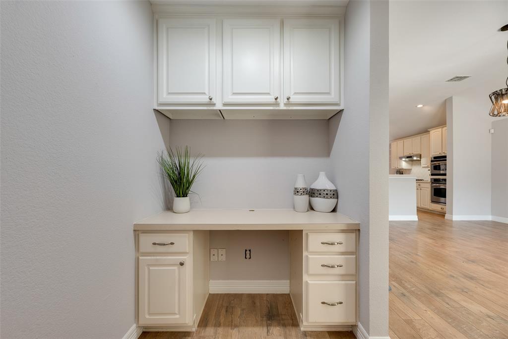 1430 Silver Spur Drive Allen, TX 75002 - Photo 25 of 34 a view of cabinets and wooden floor