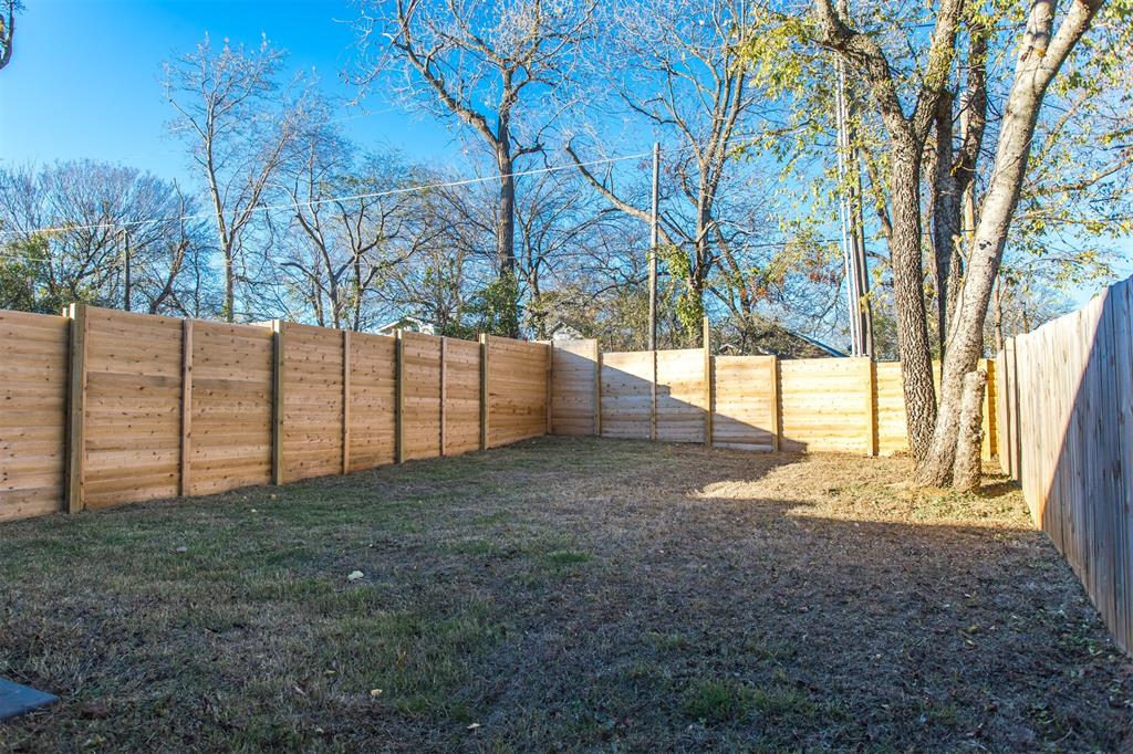 415 West Elm Street, Unit 415 Denison, TX 75020 - Photo 14 of 17 a view of backyard with tree