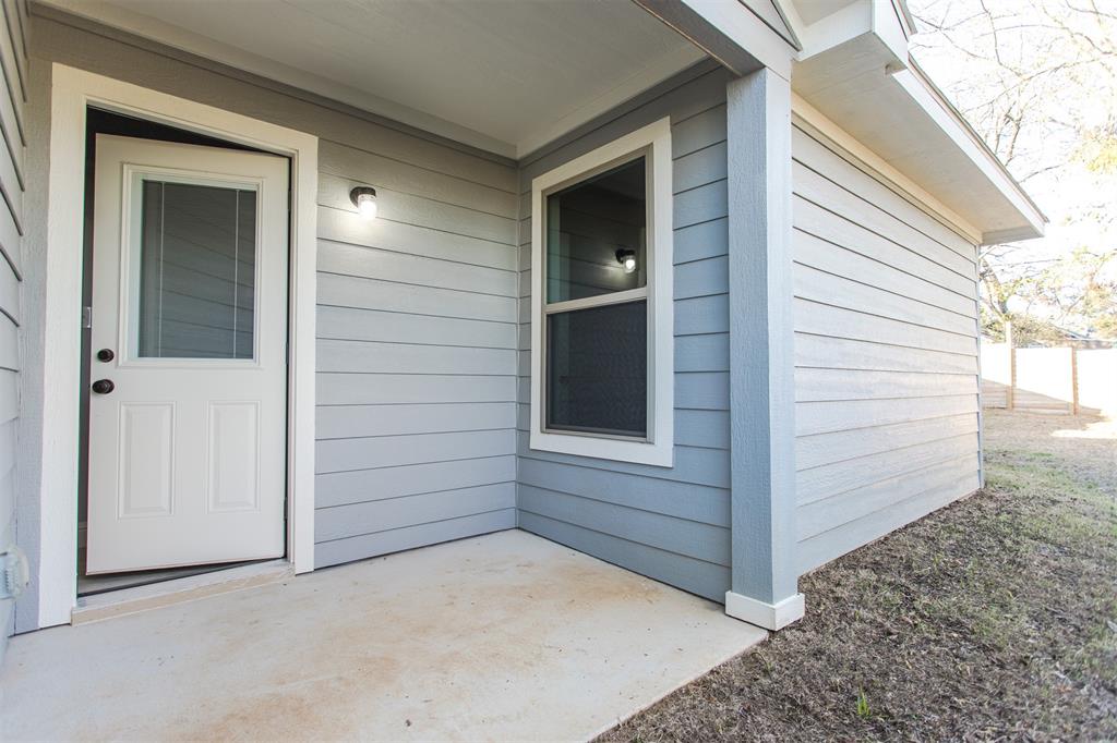 415 West Elm Street, Unit 415 Denison, TX 75020 - Photo 16 of 17 a view of front door and yard of the house