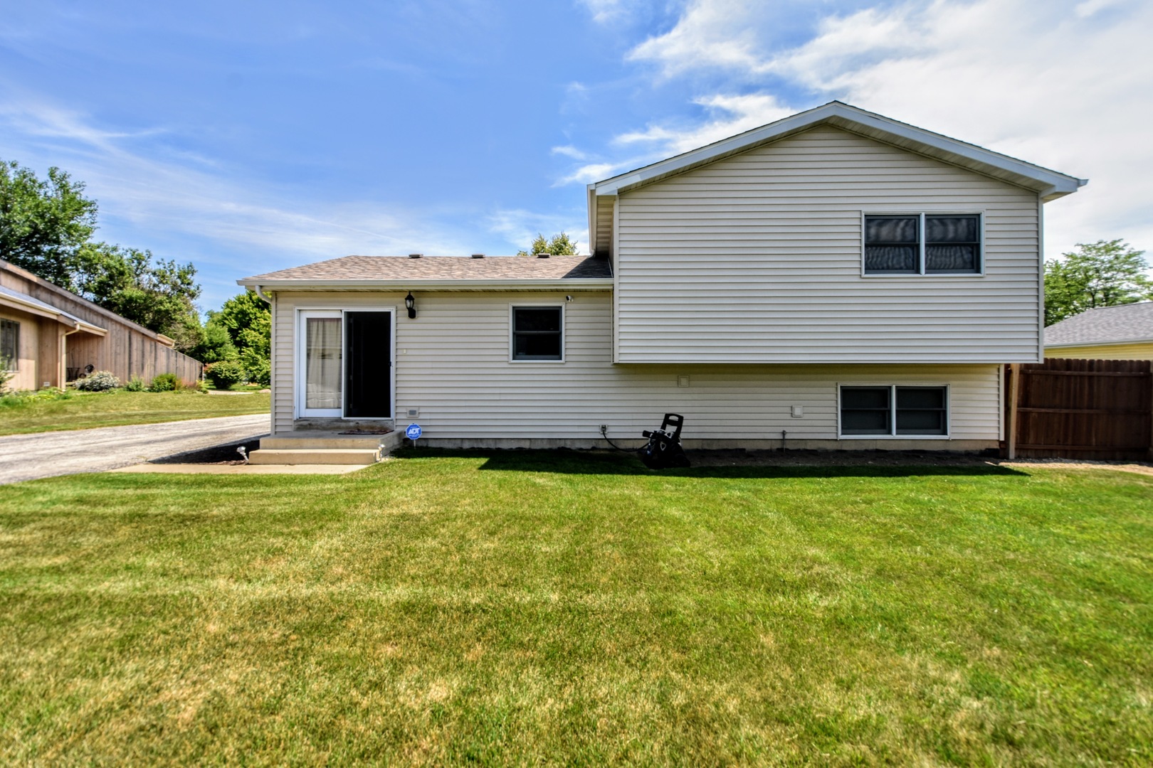4002 Ridge Road Zion, IL 60099 - Photo 25 of 26 a front view of house with yard having outdoor seating