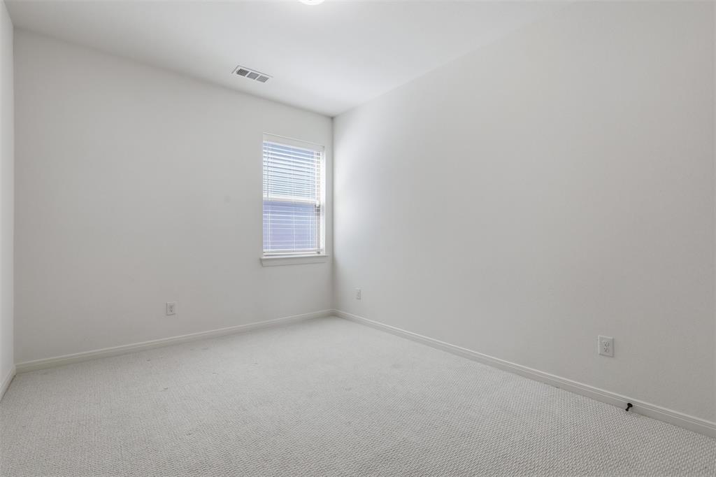 15413 Short Rdg Lane Fort Worth, TX 76008 - Photo 27 of 39 Carpeted interior room with white walls, a single window with blinds, and white trim