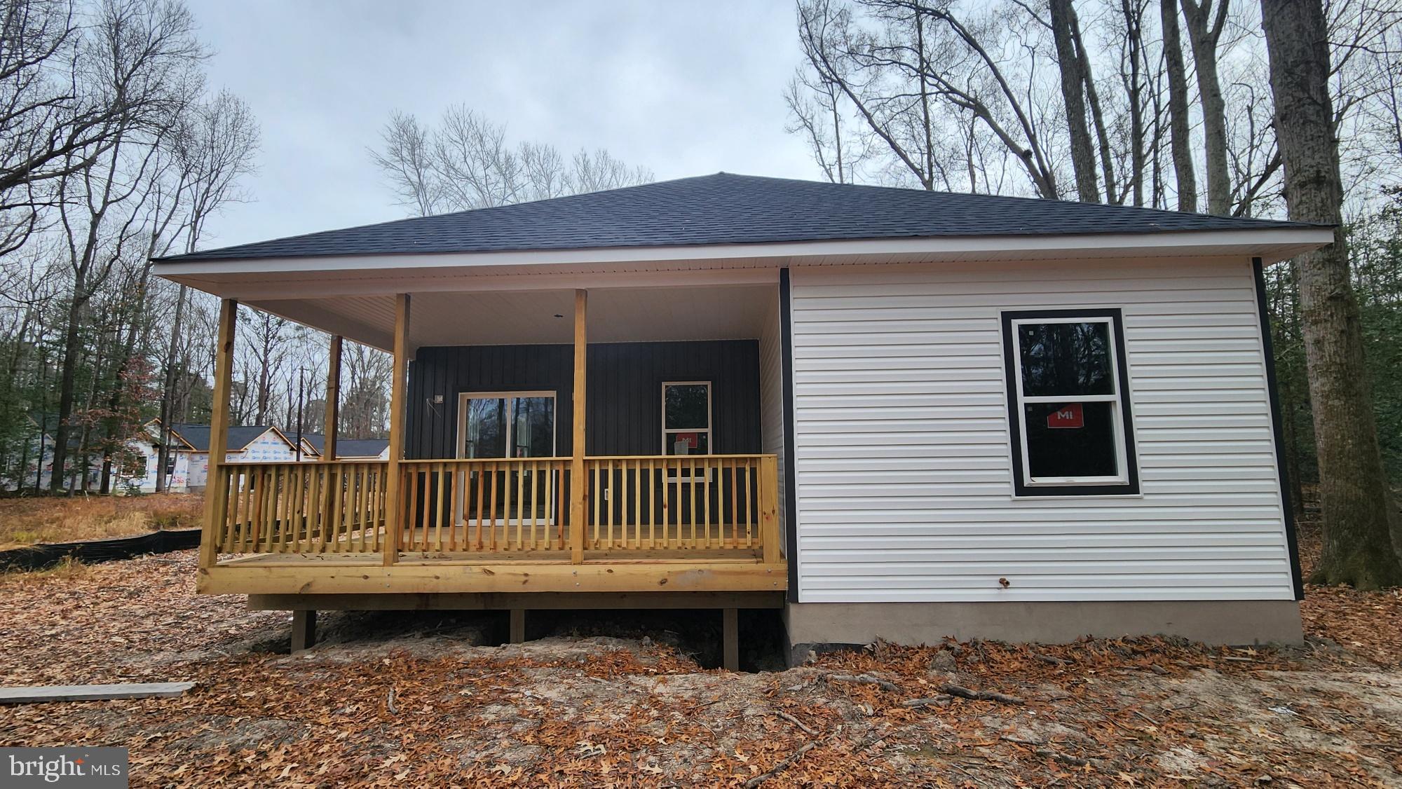 175 Rose Way Colonial Beach, VA 22443 - Photo 3 of 16 a view of a house with a yard