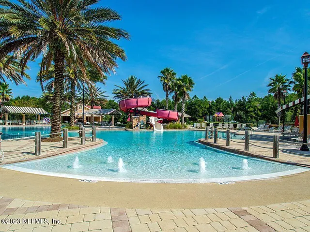 a view of a swimming pool with a garden
