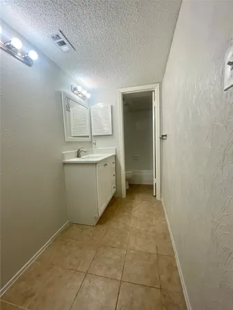 a view of a storage & utility room with a sink