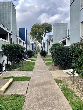 a front view of a building with garden