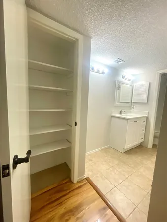 a view of a kitchen with a sink