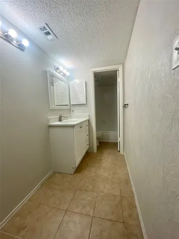 a view of a storage & utility room with a sink