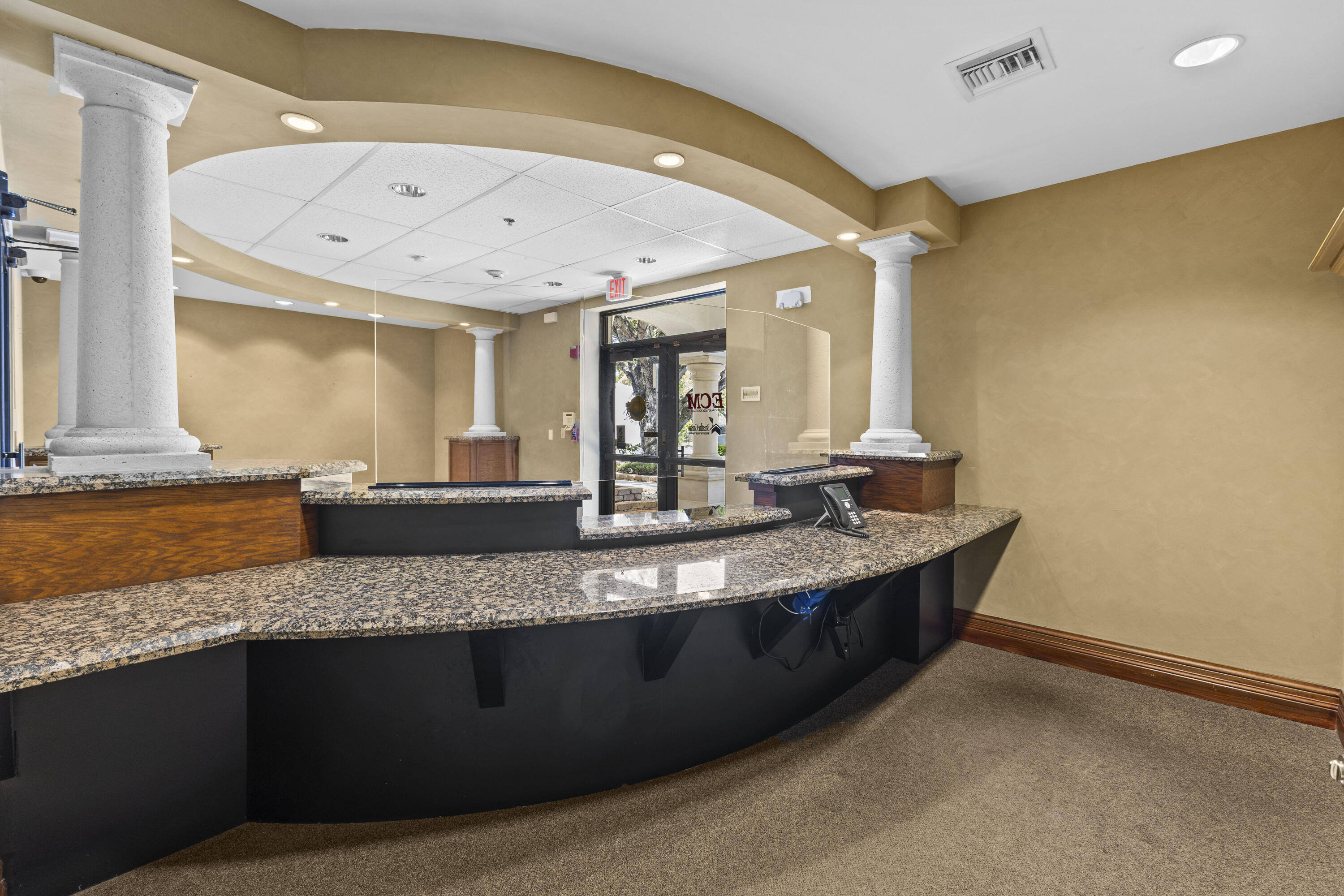 1500 High Ridge Road Boynton Beach, FL 33426 - Photo 11 of 35 a view of a large kitchen with a sink a counter space and stainless steel appliances