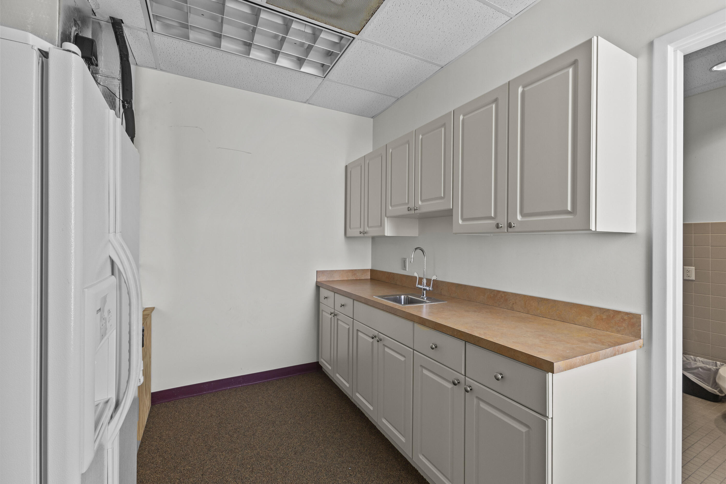 1500 High Ridge Road Boynton Beach, FL 33426 - Photo 20 of 35 a utility room with cabinets washer and dryer