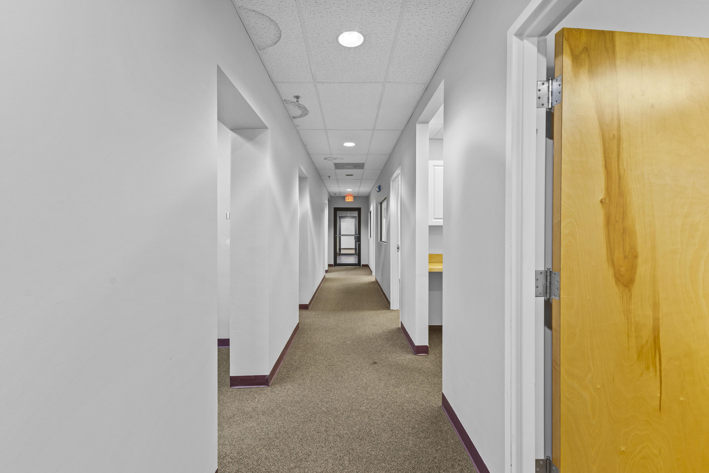 1500 High Ridge Road Boynton Beach, FL 33426 - Photo 25 of 35 a view of a hallway with wooden shelves