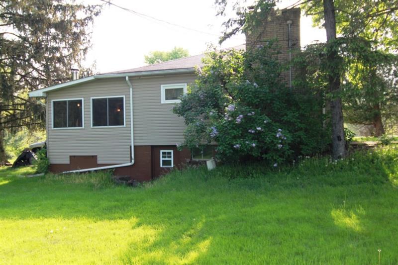 146 Love Road Valencia, PA 16059 - Photo 22 of 23 Left Side of House: Exterior access to walkout basement.