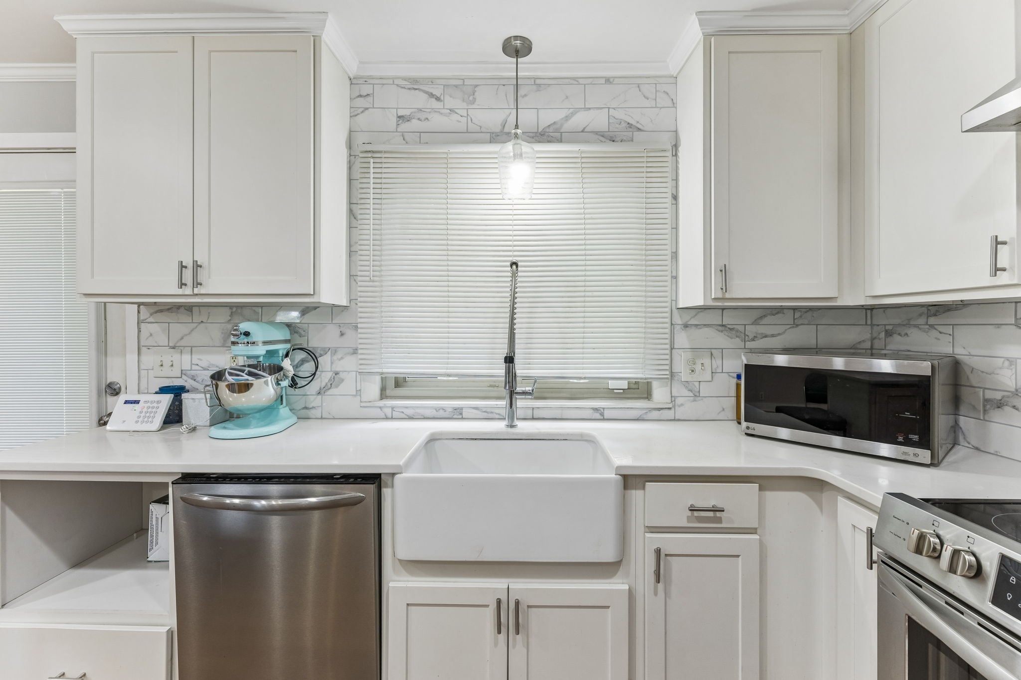 4425 Prescott Road Nashville, TN 37204 - Photo 18 of 36 a kitchen with stainless steel appliances a sink stove and cabinets