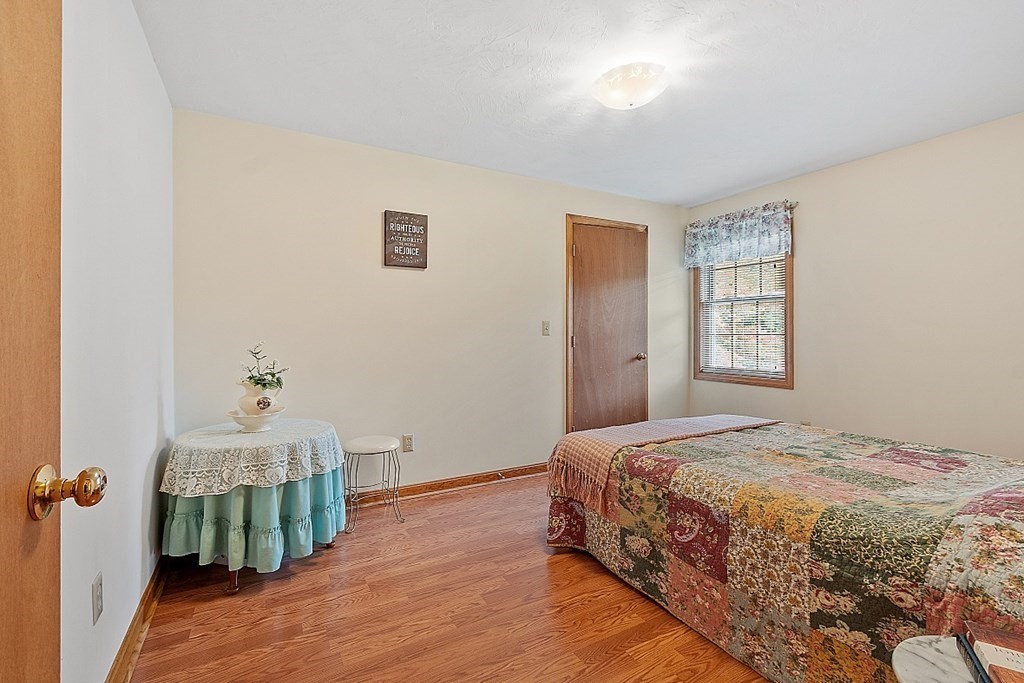 252 Great Road Shirley, MA 01464 - Photo 11 of 42 a bedroom with a bed and a window