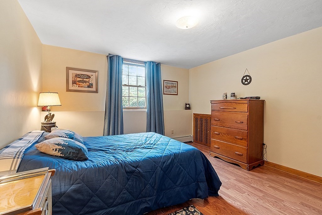 252 Great Road Shirley, MA 01464 - Photo 26 of 42 a bedroom with a bed and a dresser