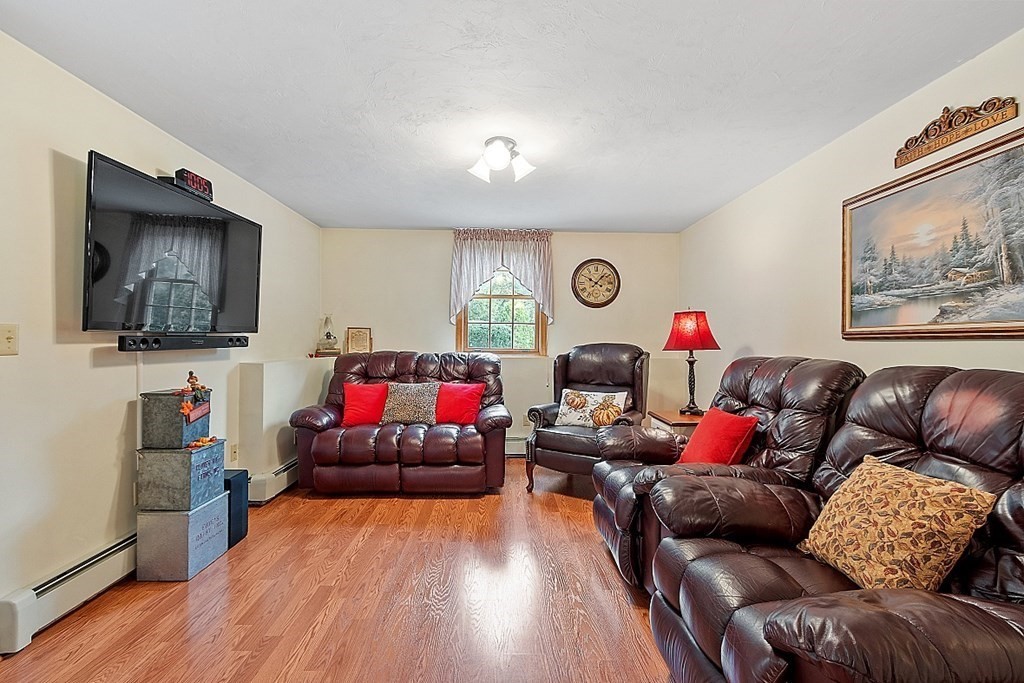 252 Great Road Shirley, MA 01464 - Photo 31 of 42 a living room with furniture and a flat screen tv